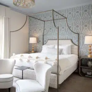Flying Arch Canopy Bed in a hospitality setting